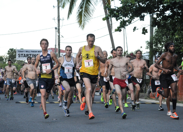 Runners dart away from the starting line in the 20th annual 8 Tuff Miles race on St. John.