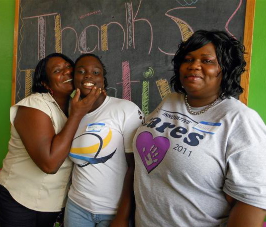 Jackie Brown, Nitisha Hodge and Malissa Eustache mug for camera at the Boys and Girls Club.