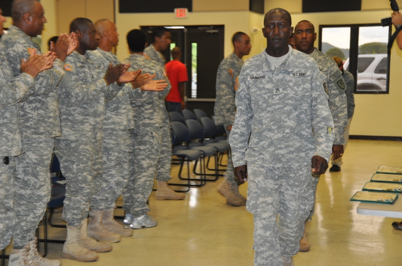 Deploying soldiers of the 104th RAID team enter UVI's Great Hall to a thunderous applause.