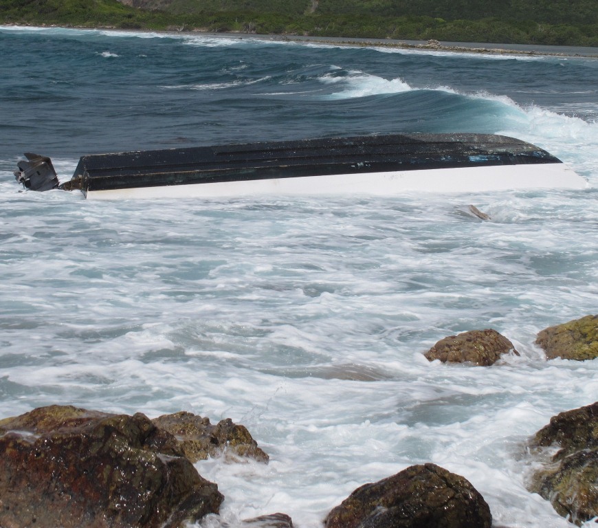 The capsized craft Fishtail among the reefs at False Entrance (Photo courtesy V.I. Ecotours)