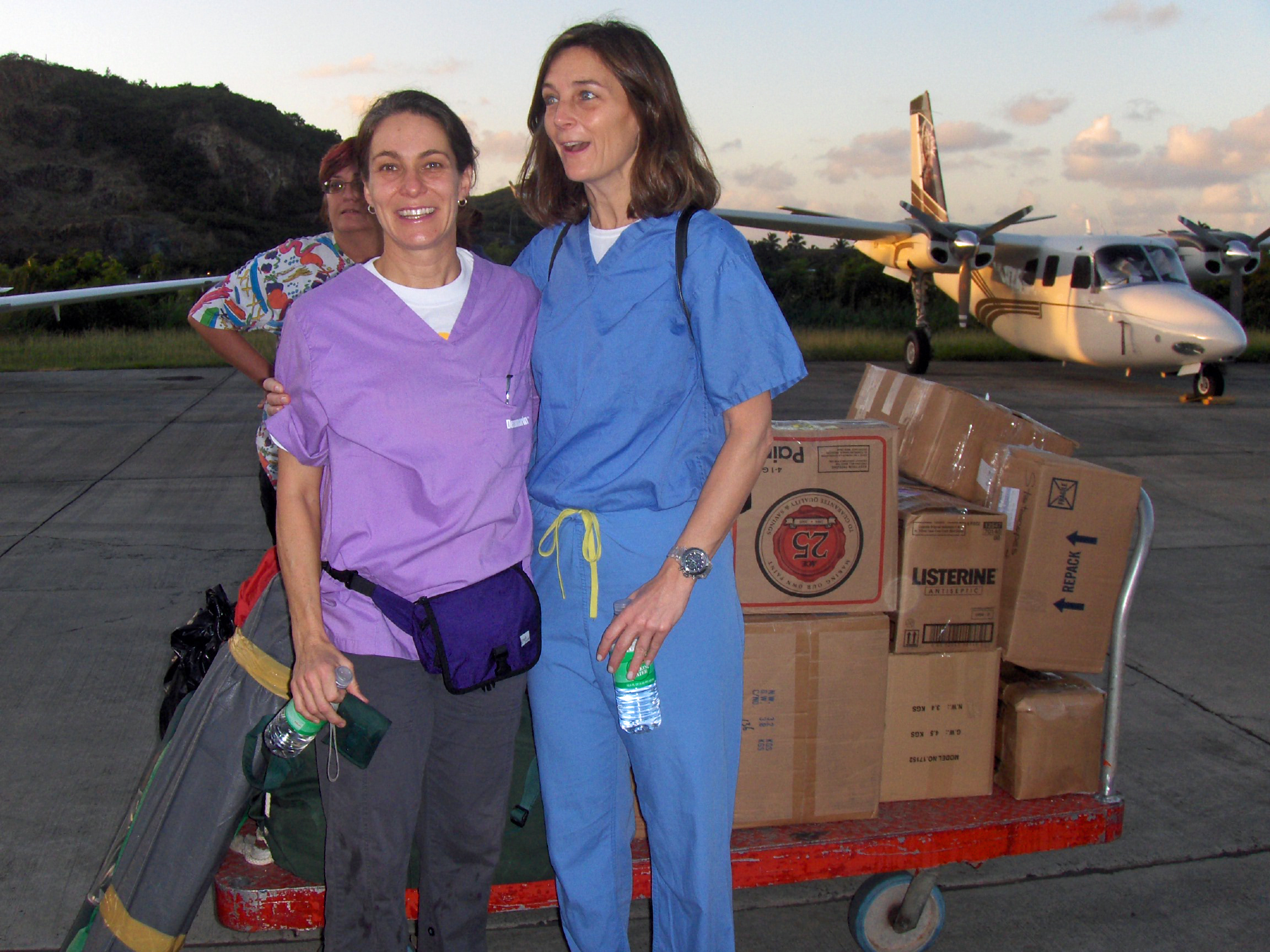 Anthropologist Catherine Colby and pediatrician Kathleen Hunt at the Jet Center with supplies from Tennessee.