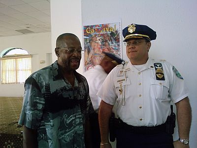 Carnival Committee Executive Director Caswil Callender (left) talks with District Police Chief Rodney Querrard Sr. after Wednesday's press conference.