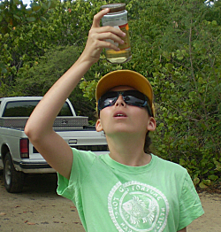 Maggie Zumwalt checks out a scaly specimen.