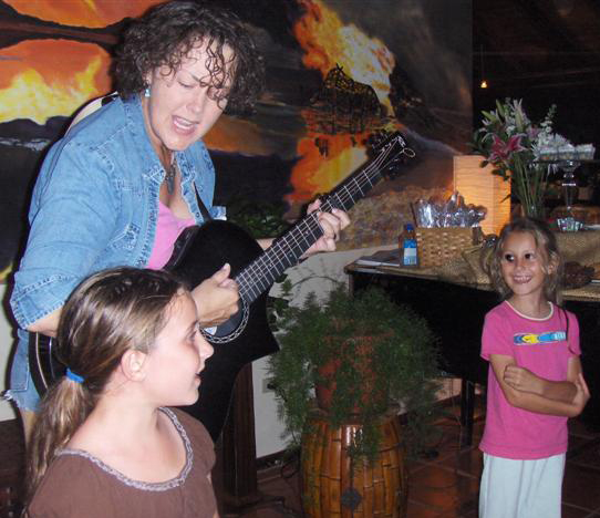 Dr. Julia Gardner plays guitar with a little help from her friends.