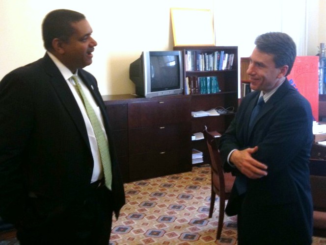 Gov. John deJongh Jr. confers with Assistant Secretary Michael Mundaca.