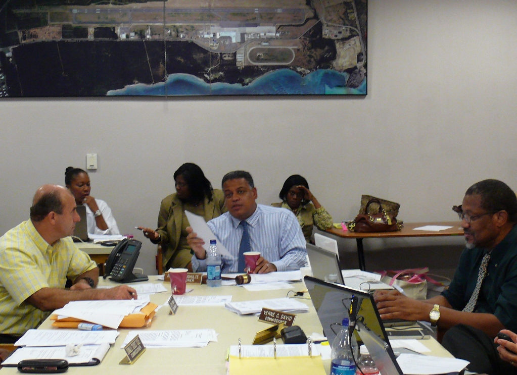 PSC Chairman Joseph Boschulte (center) inquires about the LEAC surcharge, while PSC members Sirri Hamad (left) and Verne David (right) look on.