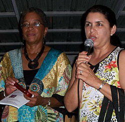 Delegate Donna M. Christensen (left) and park service historian Milagros Flores.