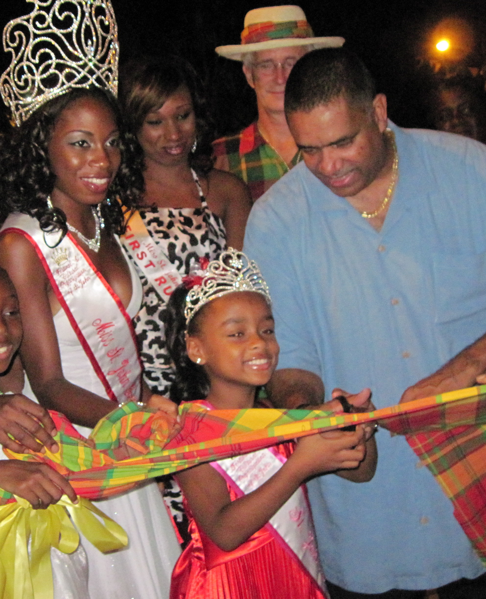 In 2010, Queen Shante Monsanto-Weeks, Princess Destini Garcia and Gov. John deJongh Jr. cut the ribbon to open the festival vllage.