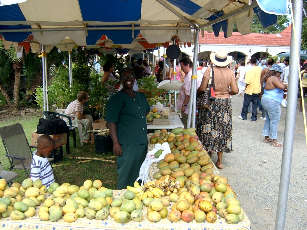 Gloria Neale-Felix with a dozen varieties of mangoes at Mango Melee 2006.