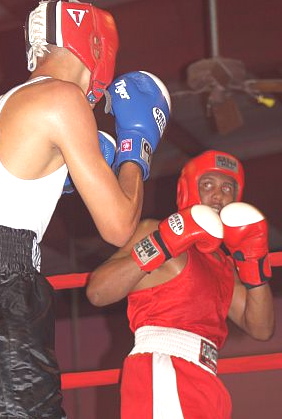 The V.I.'s Jefferey Velasquez, in red, squares off against Puerto Rico's  Emmanuel Carmona. 