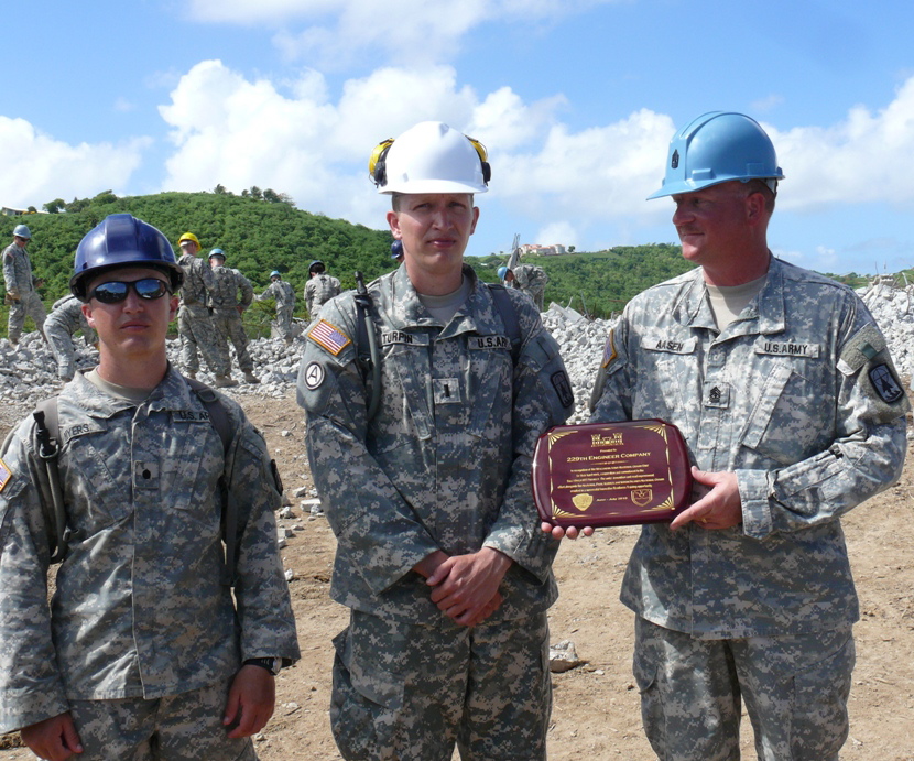Cadet Keegan Myers,  Lt. Robert Turpin and First Sgt. Andrew Aasen of the Wisconsin National Guard with a plaque of appreciation given them by the V.I. National Guard Wednesday.