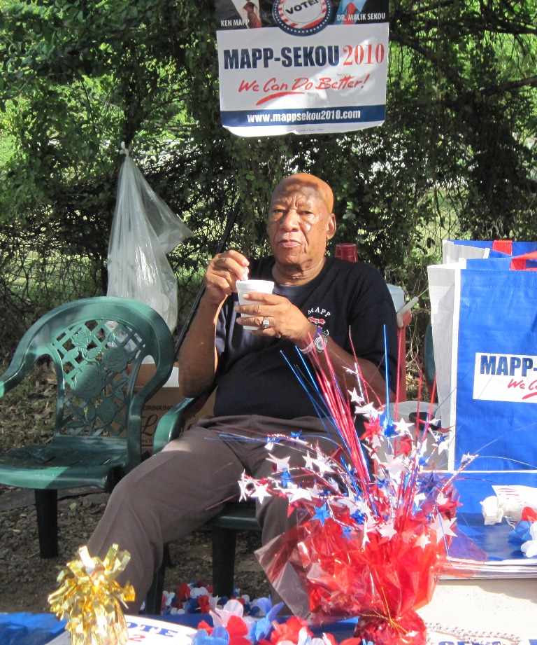 Mapp supporter Austin Dalmida relaxes at Guy Benjamin.