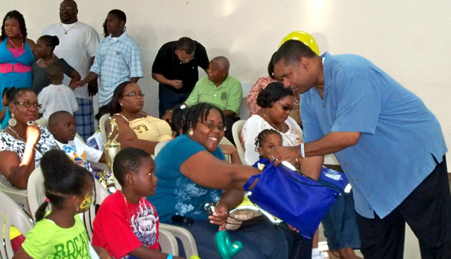 Audience members help Gov. John deJongh draw raffle tickets.
