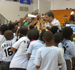 P-Jam organizer Nels Hawkinson greets students from Ulla F. Muller Elementary School at halftime.