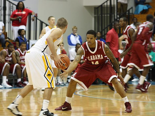 Alabama's Kendall Durant defends against an Iowa Hawkeye