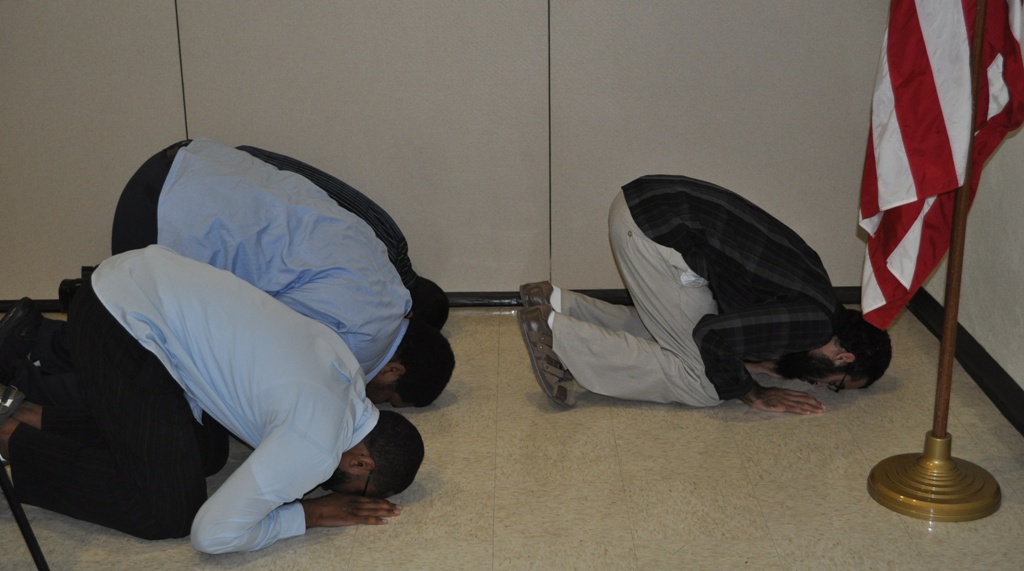 Students and instructors of the IQRA Academy pray together before breaking the fast.