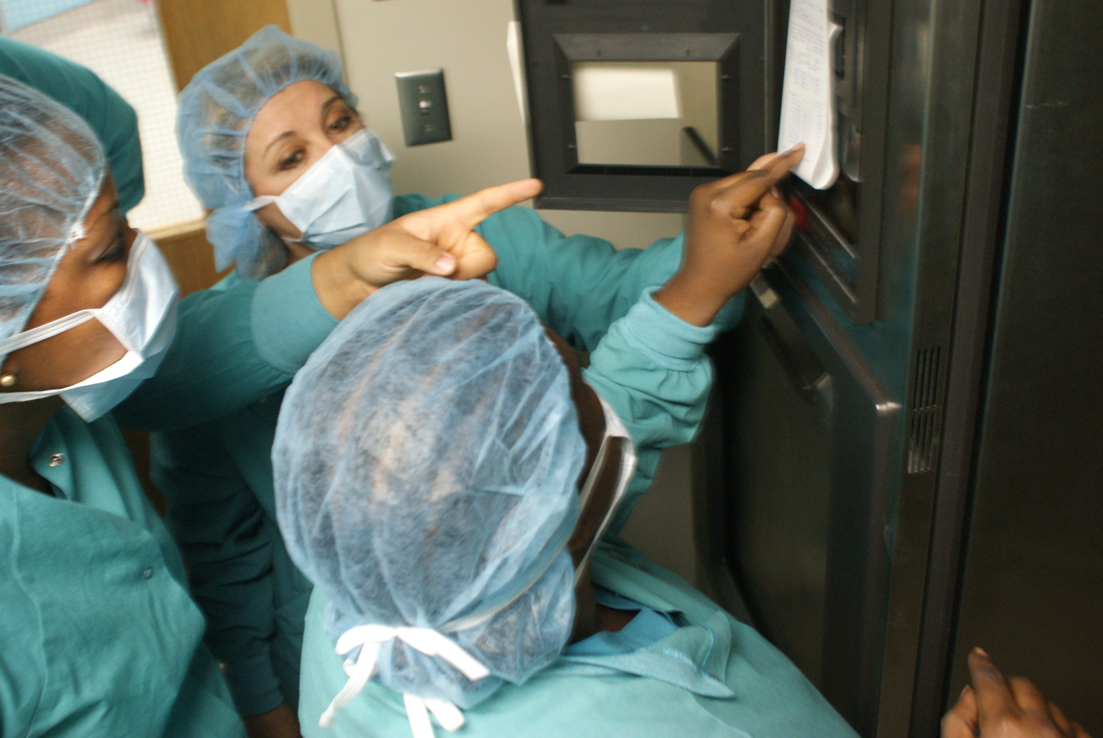 Surgical technicians reviewing critical information. (Photo Deenica LaPlace) 