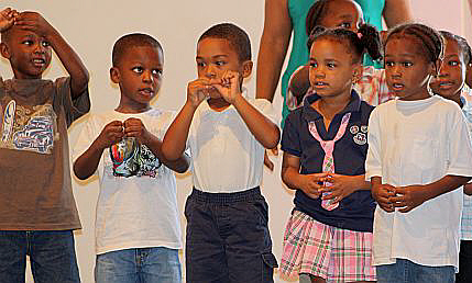 Students at College Preparatory Early Learning Center sing "Itsy Bitsy Spider."