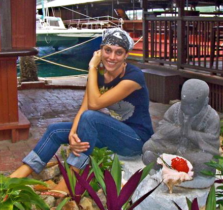 Katie Lombardo sits at the entrance to her sushi bar, Enkai.