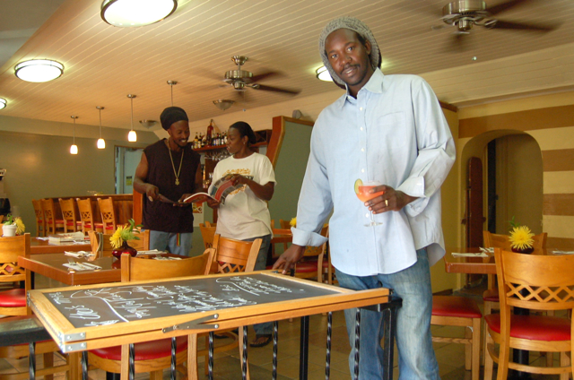 Leslie 'Theo' Gumbs checks the menu at his latest venture, the restaurant Theo's.