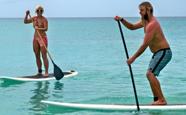 Pi Presto and Bill Ruggiero, operators of Stand Up Paddle Boarding, demonstrate their sport.
