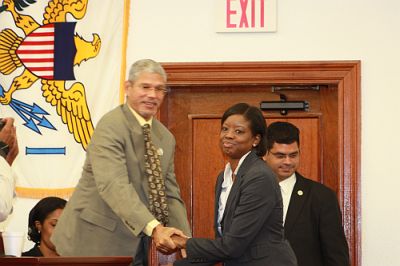 Alicia Barnes shakes hands with Senate President Ronald E. Russell after being  confirmed as DPNR commissioner.