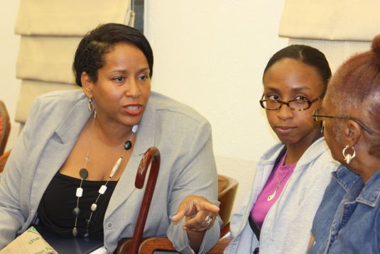 Josephine Lindquist (left) and daughter Jasmine speak on behalf of the Bournefield residents at Thursday's meeting.