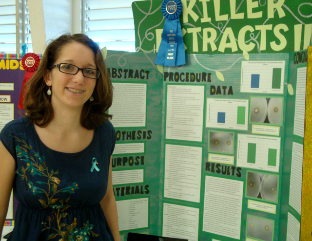 Eliza Mongeau explains her experiment, “Killer Extracts,” at the Good Hope Science and Engineering Fair.