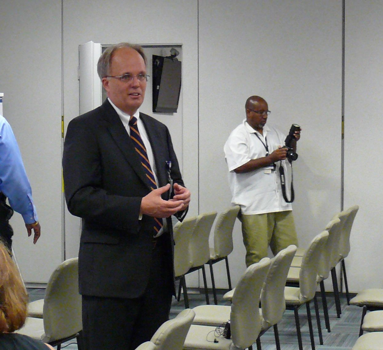 Gov. Juan F. Luis Hospital CEO Jeff Nelson speaks with St. Croix residents at a town meeting Tuesday.