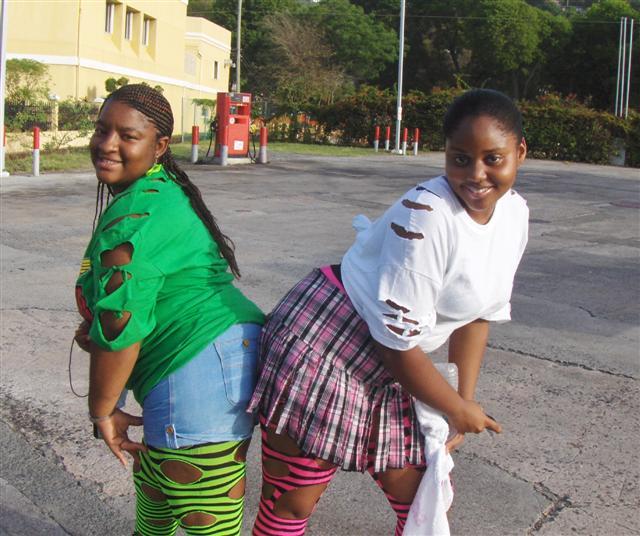 Belke Testamark and Elaine Green take a minute from the tramp to model J&rsquo;ouvert long socks.