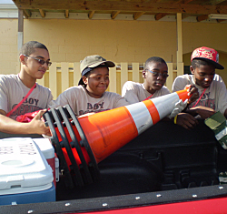 Christopher Rosario (from left), Marcelis Maccow, Maleek Matthew, and Jordon Gordon getting ready to clean the roadside.