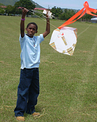 Savon Washington concentrates on getting his kite airborne.
