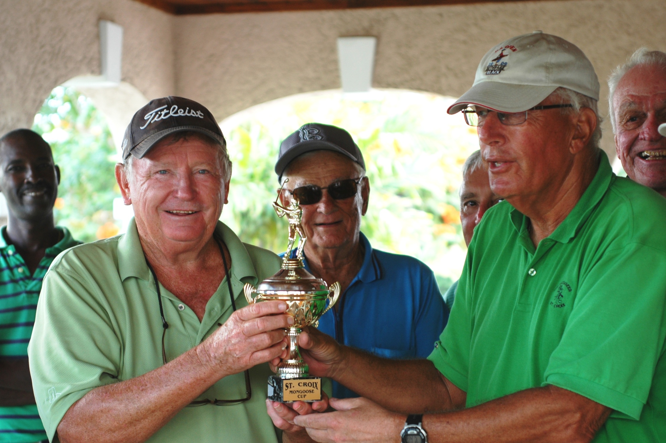 Little Boys captain Frank Lange accepts the 2010 Mongoose Cup from Dem Boys captain Max Blum.