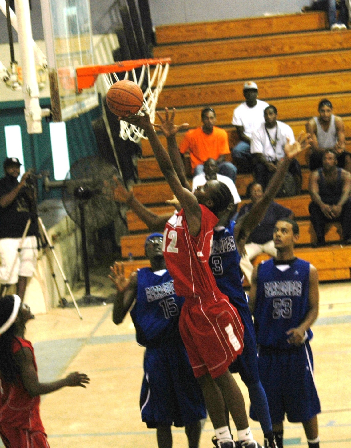 Amadeus Derweer scores two of his eight points during the Caribs' third-quarter run.