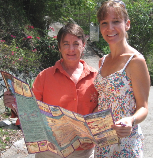 Denise Barbier and Jen Knowles Donnelly display their St. John Treasure Map and Guide.