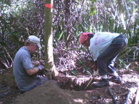 Volunteers Tom Williamson and Cathy Prince dig holes for the education pavilion.