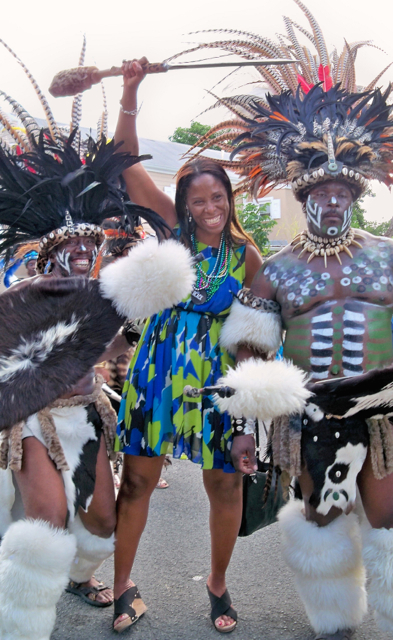 Delegate-elect Stacy Plaskett poses with the Zulu troupe Saturday in the Crucian Christmas Carnival Adult Parade.