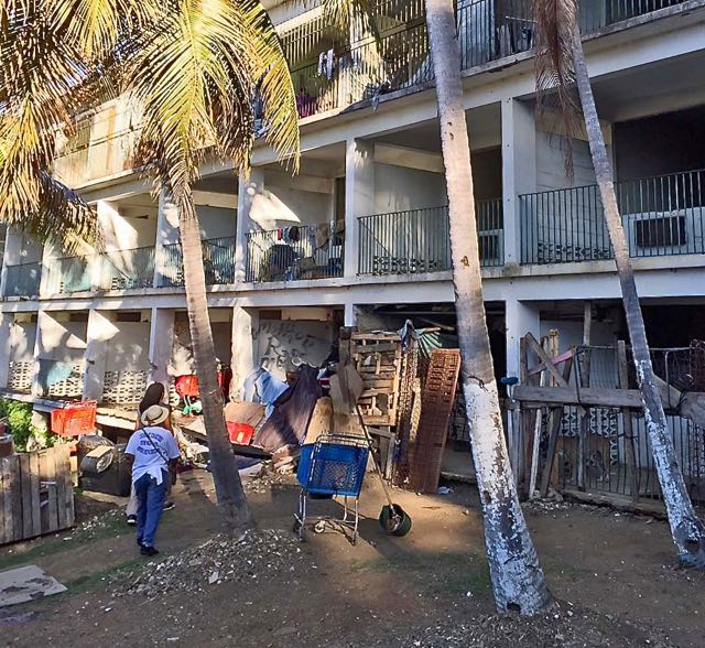 Andrea Shillingford interviews residents of Michele Motel (Photo by Michael Akin, Catholic Charities) director)