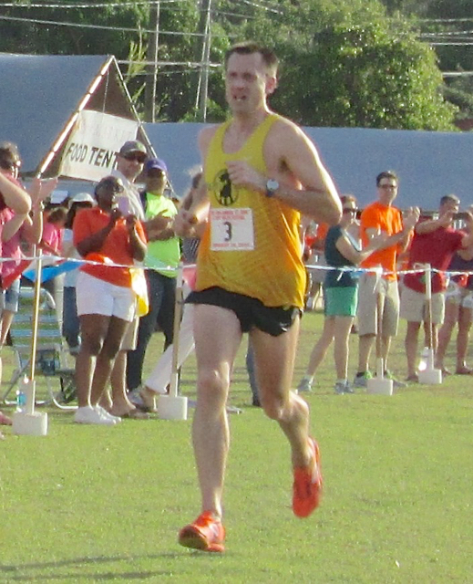 Men&rsquo;s winner Paul Jones crosses the finish line in 52 minutes and 34 seconds in the 8 Tuff Miles race.