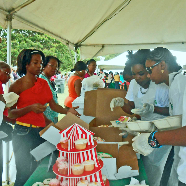 The crowd descends on the cupcakes at Sunday's Afternoon on the Green.