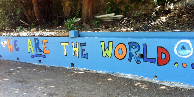 A group of 15 students plus adult volunteers gave a bright, fresh coat of paint to this wall in Estate Honduras.