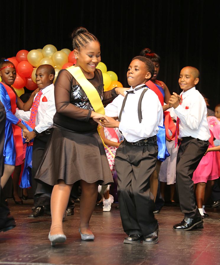 Yorleny Durand, left, and Avanni Ahanzi, of E. Benjamin Oliver Elementary,  jump up for the swing during Saturday's competition.