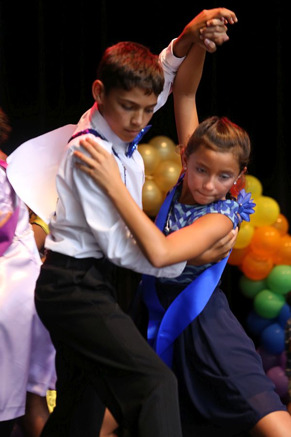 Luca Hotze, left, and Audrey Moore of Antilles School dip for the tango.