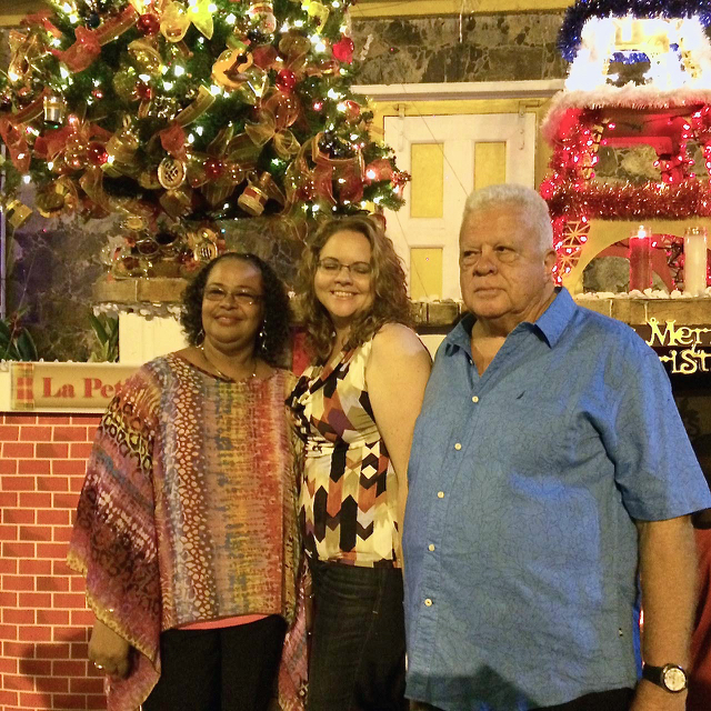 Lisa Hunt, Cindy Richardson and Henry Richardson celebrate their winning tree.