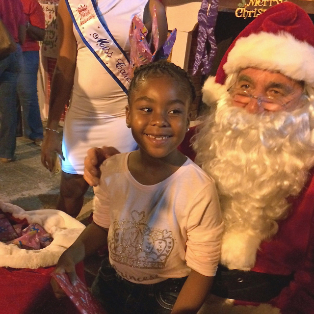 Santa's arrival at the Christmas Festival of Lights brought smiles to young faces.