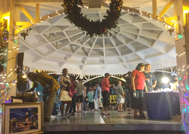 Shoppers browse among locally-made items at the Emancipation Park gazebo.