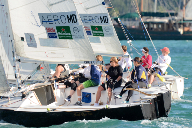 Close racing between the USA&rsquo;s Dave Dellenbaugh, far right in a red cap, and Brazil&rsquo;s Julianna Senfft, on the tiller on the black-hulled boat in the foreground. (Dean Barnes photo)