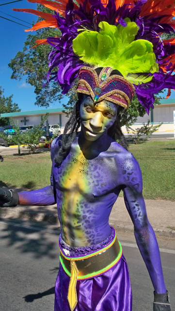 A painted dancer in the parade.