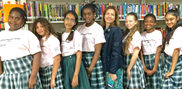 The V.I. Kings Cyber Patriot team, from left, Kaylin Wallen, grade 7, age 12; Mimi Boumedine, grade 6, age 11; Drishti Tejwani, grade 7, age 12; J'Synyah Hyndman, grade 8, age 13; Rebecca Hoffart, coach; Angela Blake, grade 8, age 13; Iyana Frett, grade 6, age 11; Sakhshi Parwani, grade 7, age 12.