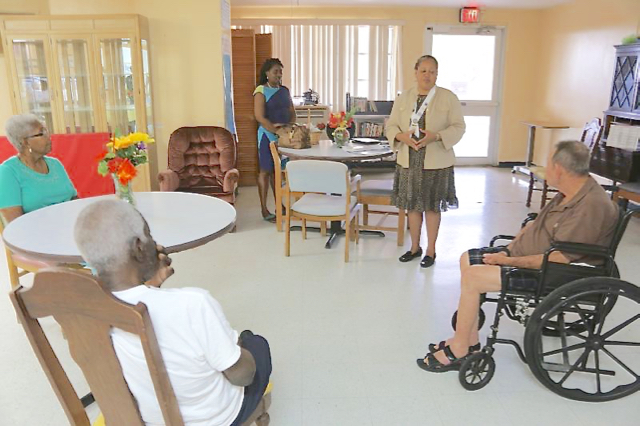 Inner Wheel president Paula Edwards greets residents of Sea View Nursing Home on National Inner Wheel Day.